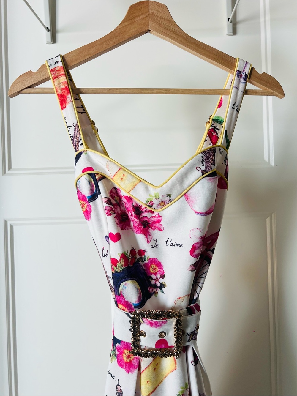 White Floral Midi Dress with Pink Accents and Decorative Belt